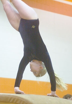 Amanda Alig, Coldwater High School gymnastics team member,  participates on the vault in a February competition. The school's gymnastics program is now slated to continue another year as a varisty sport.<br>dailystandard.com