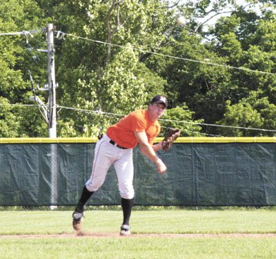 Minster's Tim Cordonnier fires to first base during action from Saturday's regional final game with Triad at Huber Heights.<br>dailystandard.com