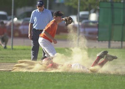 Minster second baseman Max Philpot, 28, throws the ball to first base in an attempt at a double play as New Bremen's Brian Garman, 44, begins his slide with Minster shortstop Zac Boeke backing up the play. Minster defeated New Bremen 6-3 to earn a berth in the state ACME tournament held in Bryan.<br>dailystandard.com