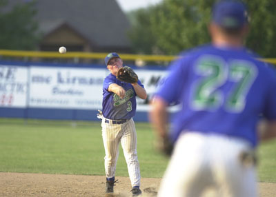 Grand Lake shortstop Dusty Hammond, left, fires the ball to first baseman Andy Hudak, 27, during their game against Lima on Thursday evening at Jim Hoess Field. Lima defeated Grand Lake 2-0 to halt the Mariners' six-game winning streak.<br>dailystandard.com