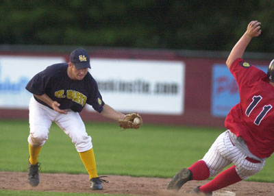 St. Marys Post 323's Matt Helmstetter, left, tries to get over to make the tag as Lima Post 96's Jeff Peters slides into second during Wednesday's American Legion District Two All-Star Game.<br>dailystandard.com