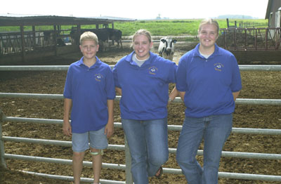 From left are John, Brenda and Sara Broering, siblings, who have received almost $30,000 over the past several years from the USDA's Rural Youth Loan Program to buy cattle for the family's dairy.<br>dailystandard.com