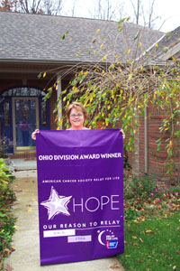 Shirley James of New Bremen, chairman for the Southwestern Auglaize County Relay for Life, holds the first-place banner awarded by the Ohio Division of the American Cancer Society.<br>dailystandard.com