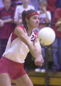 St. Henry's Lindsey Thobe passes the ball to a teammate during tournament action at Vandalia-Butler High School. St. Henry defeated Lehman in four games.<br>dailystandard.com