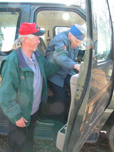 Gene Powell, full-time driver for Mercer County Veterans Service, helps Rockford resident and U.S. Army veteran George Wilson out of the county van following a recent trip. Powell has driven local veterans to hospitals, doctor appointments and other destinations for 14 years.<br>dailystandard.com
