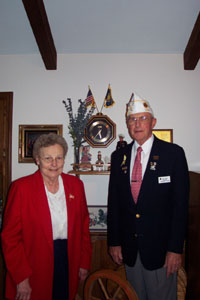 Martha and Virgil Arling stand before a patriotic display at their Minster home. The couple are actively involved in American Legion and Auxiliary activities on the local, state and national level.<br>dailystandard.com