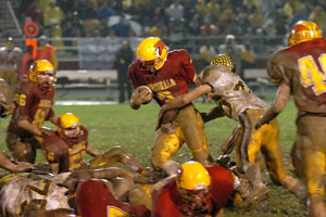 New Bremen's Chris Grant fights for extra yardage during the Division VI regional final against Hardin Northern on Friday.<br>dailystandard.com