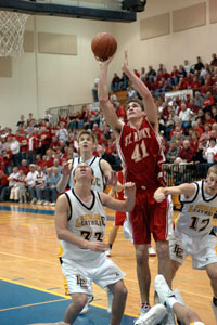 St. Henry's Kurt Huelsman scored 12 points under heavy defensive pressure. The Redskins lost their first game of the season 48-45 to St. John's on Sunday.<br>dailystandard.com