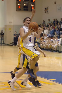 Tom Burke drives to the lane on this play, but the St. Marys junior broke his own record for three-pointers in a single game as the Roughriders won 67-53.<br>dailystandard.com