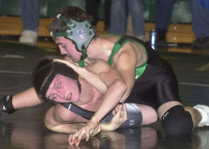 Celina's Andy Swain, top, puts his all into rolling over Elida's Jason Hunlock during Tuesday's WBL match. Swain beat Hunlock 10-8 in the 112-pound bout.<br>dailystandard.com
