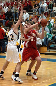 Toby Boeckman, with ball in this file photo, has been solid off the bench for St. Henry. The junior averages 7.1 points and 6.8 rebounds per game this season.<br>dailystandard.com