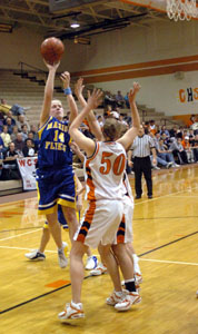 Marion Local guard Maria Moeller, 14, shoots over Coldwater's Kendra Robbins, 50, during their game on Thursday night.<br>dailystandard.com