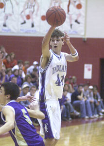 Fort Recovery's Travis VanSkyock, 41, passes to an open teammate during their Division IV district semifinal contest on Tuesday night at Wapakoneta High School. VanSkyock scored a game-high 23 points as Fort Recovery defeated Ada, 58-48.<br>dailystandard.com