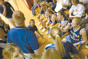 Treva Fortkamp, kneeling in the middle during a timeout, led the Marion Local Flyers to the regional final for the second time in three seasons.<br>dailystandard.com