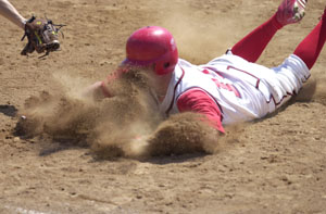 St. Henry's Brady Schmitz slides safely into third base for a triple during the third inning of a game of the 12th annual WCSM/St. Henry Bank Invitational, which took place at the Wally Post Athletic Complex on Saturday. St. Henry captured the title with two wins.<br>dailystandard.com