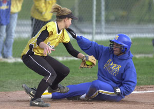 Marion Local's Kelly Pleiman, right, slides safely into third base as Parkway's Ashley Gamble makes the late tag. Parkway defeated Marion Local, 7-3.<br>dailystandard.com