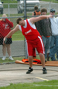 St. Henry's Steve Dailey gets ready to throw the discus during the 2005 Mercer County Knights of Columbus Track Meet at Cavalier Stadium in Coldwater on Tuesday. Dailey won the discus event and finished second in the shot put to help the Redskins to a first-day lead in the team standings.<br>dailystandard.com