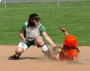 Celina shortstop Allison Braun, left, tags out an Elida baserunner during Division II sectional finals action at Bath High School on Monday. Celina, the top seed in the sectional, was beaten 1-0 by Elida.<br>dailystandard.com