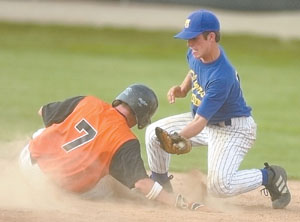 Coldwater's Trevor Stromblad, 7, slides safely into second as Marion Local's Jordan Moeller puts on the tag. Coldwater earned an ACME district berth with a 3-1 win over the Flyers.<br>dailystandard.com