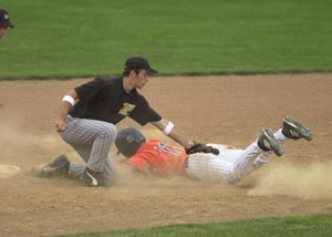 Minster's Aaron Heitbrink, right, slides safely into second base as Parkway's Derek Snyder, left, tries to apply the tag during Wednesday's ACME district game at St. Henry's Wally Post Athletic Complex. Parkway defeated Minster, 6-3.<br>dailystandard.com