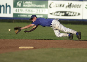 Grand Lake's Dusty Hammond dives to make the stop on a grounder during Tuesday's game with Lima at Jim Hoess Field.<br>dailystandard.com