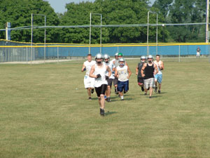 Members of the West Ohio Wranglers warm up for practice on Wednesday at K.C. Geiger Park in St. Marys. The Wranglers open their inaugural season in the Insterstate Football League on Saturday at LaGrange County.<br>dailystandard.com