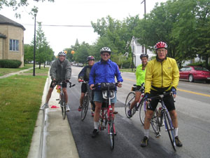 Two hundred bike riders passed through St. Marys on Wednesday en route to New Bremen where they'll stop at the bicycle museum. XOBA, the Across Ohio Bicycle Adventure, is traveling from Lake Erie to the Ohio River, a distance of about 275 miles, in a week. Among this group of five are Mike Lehmann of Troy, center, Jim Mathis of Leavenworth, Kan., right, and his daughter-in-law, Joanna, behind him.<br>dailystandard.com