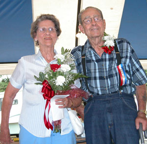 Senior Queen Roseann Osterfeld of Coldwater poses with King Arthur Krick of Celina, after the pair were chosen as royalty Thursday at the Mercer County Fair. Fair board member Barb Pierce has coordinated senior citizen's day activities during the fair for five years.<br>dailystandard.com