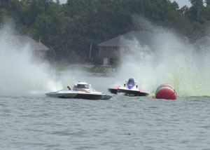Jimmy Shane, left, leads Tony Black in a 5 Litre Modified race on Sunday at The 2005 Governor's Cup Regatta on Grand Lake. Shane won all four of his races in the division on his way to three division wins and the 2005 Cup.<br>dailystandard.com