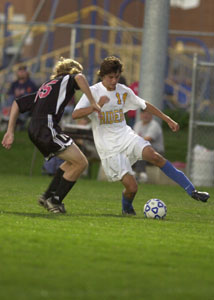 St. Marys' Geoff Hiskey, right, tries to make a move with the ball as Shawnee's Jared Linderud, left, plays defense. Shawnee defeated St. Marys, 2-0.<br></br>dailystandard.com