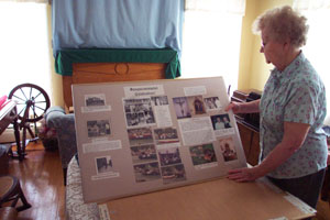 Minster resident Rita Hoying puts the finishing touches on one of 50 posters included in a Walk Through History display, one of numerous activities at the 31st Minster Oktoberfest this weekend.<br></br>dailystandard.com