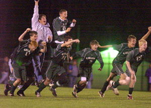 Celina players react after Aaron Schmitt's penalty kick gave the Bulldogs the win over Bowling Green in the Division I sectional tournament game held at Graham Stadium in Findlay on Monday night.<br></br>dailystandard.com