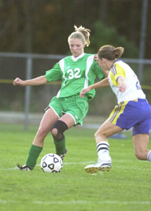 Celina's Eryn Langenkamp, 32, tries to keep the ball away from a Findlay defender during Wednesday's sectional match.<br></br>dailystandard.com