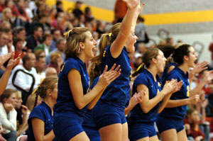 Marion Local players cheer from the bench as the Flyers put the finishing touches on a three-game win over St. Henry at the Division IV sectional tournament held at New Bremen. Marion Local won with scores of 25-20, 25-18 and 25-19.<br></br>dailystandard.com