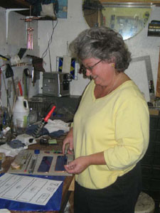 Stained glass artist Judy Beebe works at her shop where she creates custom made stained glass keepsakes. The beauty of colored glass shines the brightest when placed in the light, Beebe says.<br></br>dailystandard.com