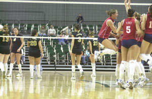 Parkway players, left, walk off the Nutter Center court on Saturday afternoon as Cleveland Villa Angela-St. Joseph players celebrate, on right, after winning the Division III state title in three games, 25-16, 25-17, 25-21. <br></br>dailystandard.com