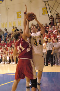 St. Marys' Adam Johns, 44, tries to shoot over St. Henry's Toby Boeckman, 31, during their game on Friday night at McBroom Gymnasium. St. Henry defeated St. Marys, 57-47.<br></br>dailystandard.com