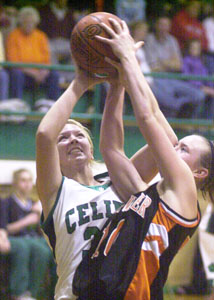 Celina's Laura Link, left, and Coldwater's Amber Heyne, right, fight for a rebound during their matchup on Thursday night at the Fieldhouse. Coldwater defeated Celina, 41-32.<br></br>dailystandard.com