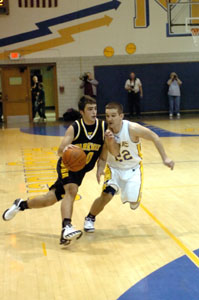 Parkway's Derik Snyder, left, drives past St. Marys' Scott Laman, 22, during their nonconference contest on Friday night at McBroom Gymnasium. Snyder scored 11 points to help the Panthers to a 53-48 win over St. Marys.<br></br>dailystandard.com