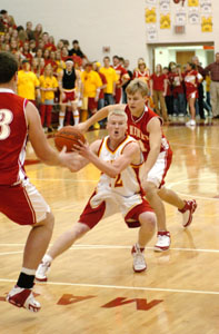 New Bremen's Scott Brackman, with ball, comes to a stop looking for an open teammate during the Cardinals' game against St. Henry on Friday. <br></br>dailystandard.com