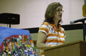 Lynn Young, flanked by photos of her son, Randy, talks to Parkway High School students Wednesday about safe driving. Randy Young, who would have turned 17 on Wednesday, was killed in a single-vehicle accident in September.<br></br>dailystandard.com