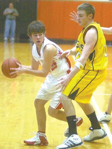 Jared Schwieterman, a St. Henry High School sophomore, looks for a good shot during a recent tournament basketball game. The 16-year-old, who has aplastic anemia, faces a bone marrow transplant in the coming months and vows to be back on the hardwood at some point during the 2006-2007 season.<br></br>dailystandard.com