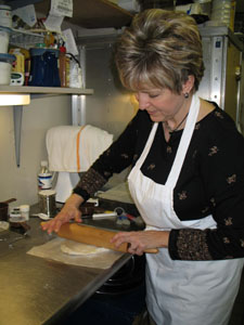 Amy Makemson rolls pastry dough at Haus der Eleganz in Minster for a special peach and red raspberry pie. Her interest in baking dates back to childhood when she stood on a chair beside her mother during regular pie- and bread-making sessions.<br></br>dailystandard.com