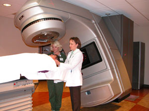 Dr. Rena Zimmerman, a board certified radiation oncologist, right, and radiation therapist Melissa Walker assist a patient recently at the Grand Lake Regional Cancer Center in Celina. The nonprofit agency has been in business now for more than three years and officials are pleased with its accomplishments so far, including a growing focus on community outreach.<br></br>dailystandard.com
