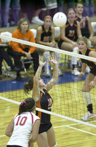 Coldwater's Marla Hess, in black, gets in position to set during Division III regional semifinal action at Liberty-Benton against Huron.<br></br>dailystandard.com