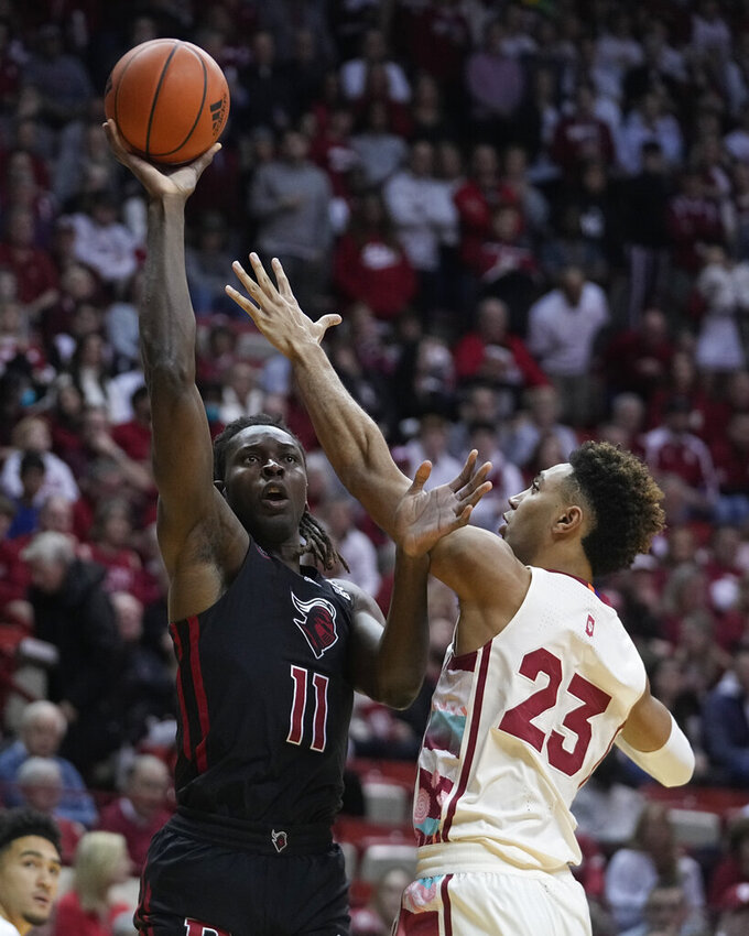 Rutgers center Clifford Omoruyi (11) shoots over Indiana forward Trayce Jackson-Davis (23) during the first half of an NCAA college basketball game Tuesday, Feb. 7, 2023, in Bloomington, Ind. (AP Photo/Darron Cummings)