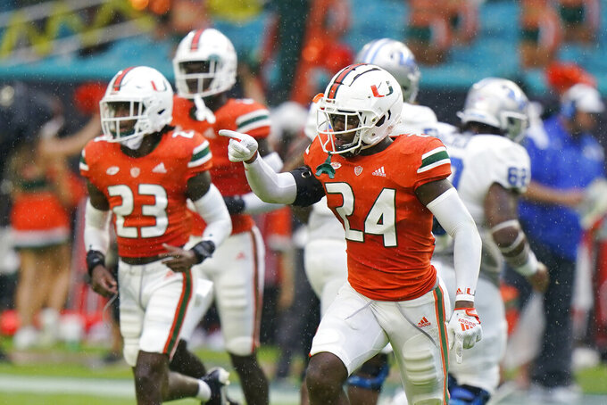 Miami safety Kamren Kinchens (24) celebrates an interception during the first half of an NCAA college football game against Middle Tennessee, Saturday, Sept. 24, 2022, in Miami Gardens, Fla. (AP Photo/Wilfredo Lee)