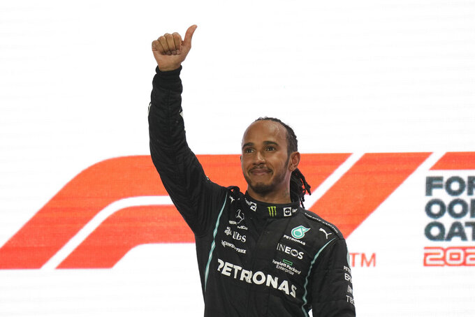 Mercedes driver Lewis Hamilton of Britain reacts after winning the Qatar Formula One Grand Prix. In Lusail, Qatar, Sunday, Nov. 21, 2021. (AP Photo/Darko Bandic)