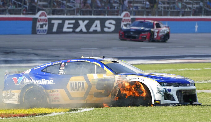 Chase Elliott's tire burns after he contacted the wall during the NASCAR Cup Series auto race at Texas Motor Speedway in Fort Worth, Texas, Sunday, Sept. 25, 2022. (AP Photo/Larry Papke)