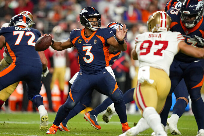 Denver Broncos quarterback Russell Wilson (3) passes against the San Francisco 49ers during the second half of an NFL football game in Denver, Sunday, Sept. 25, 2022. (AP Photo/Jack Dempsey)
